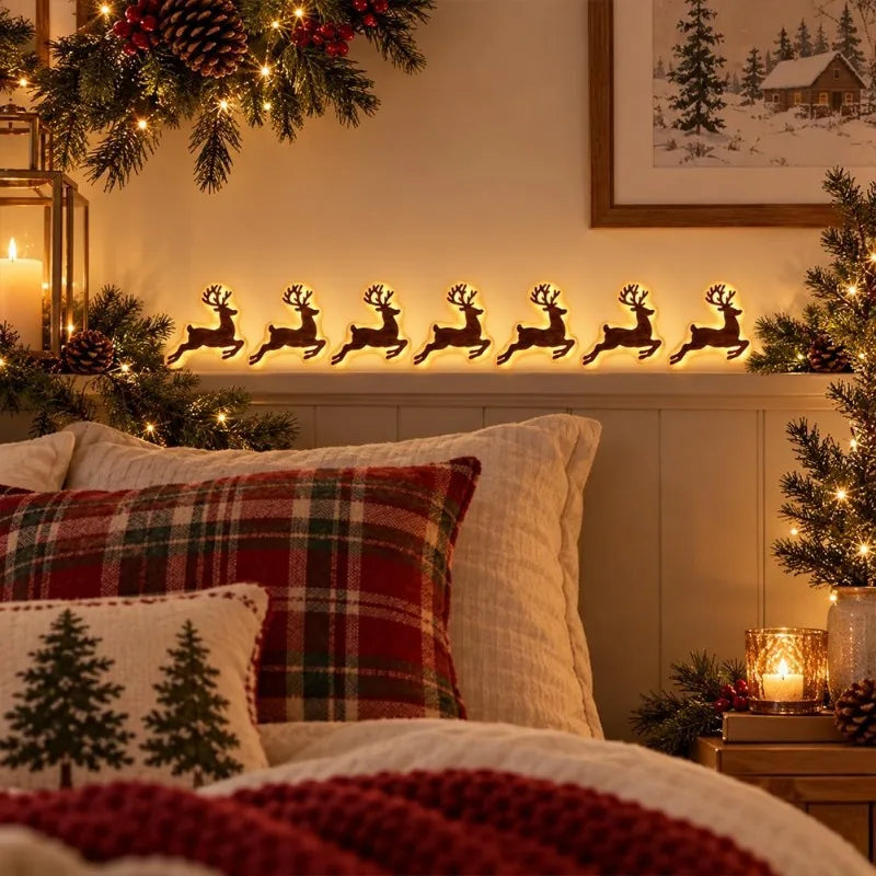 supplier photo (old) – Reindeer light silhouettes above a bed with Christmas cushio